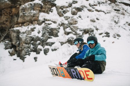 Two teenage snowboarders