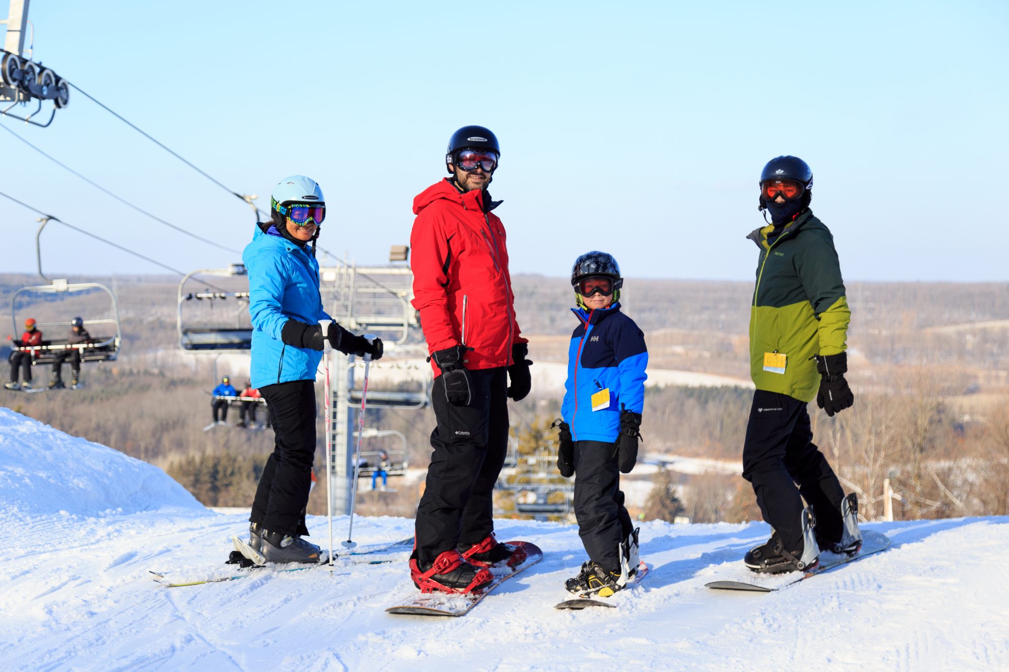 family skiing and snowboarding